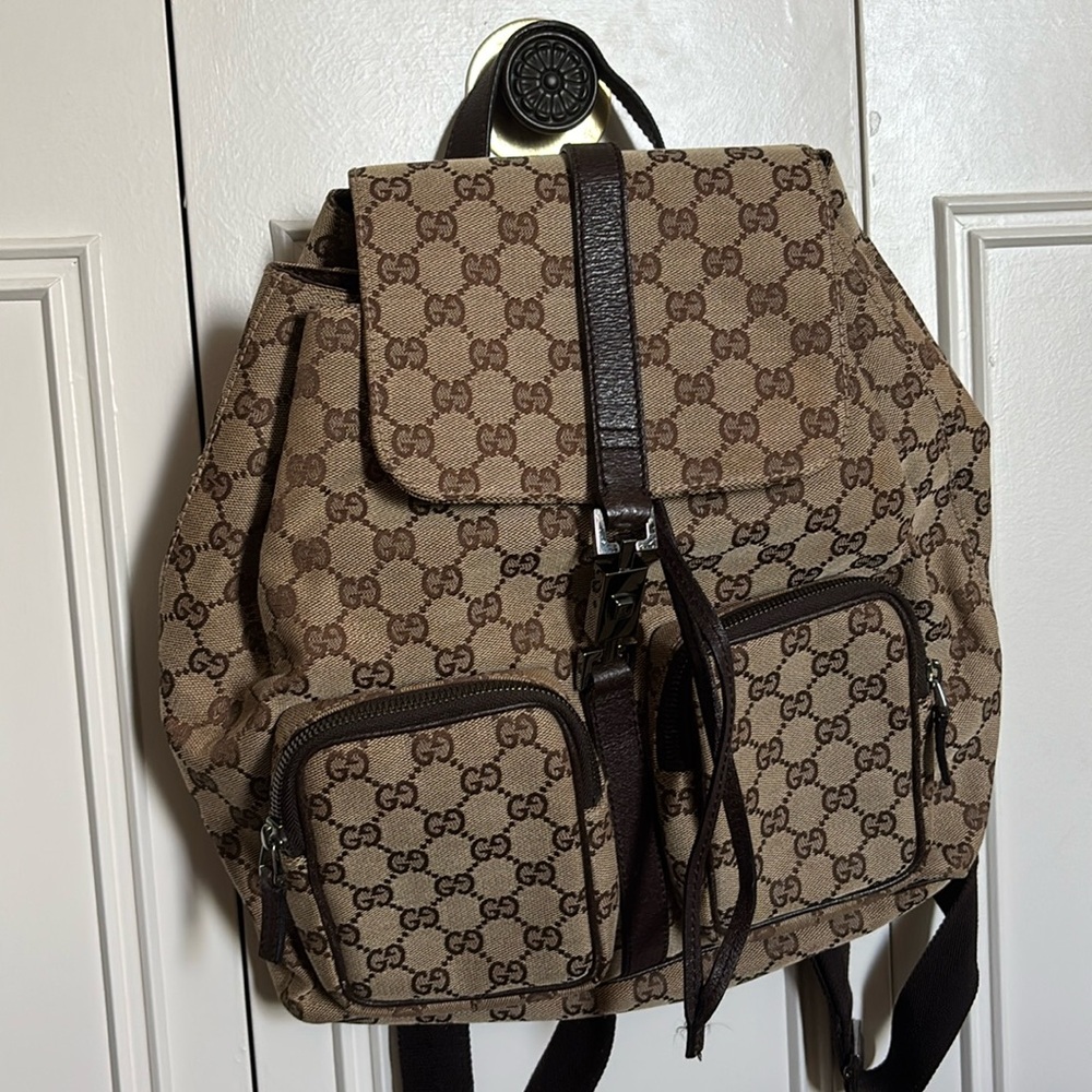 Excellent condition Gucci monogram backpack with dust-bag
